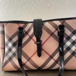 Diaper bag used a few marks as shown. Authentic Burberry 2010 bag.
